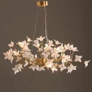 Close-up detail of hand-blown jasmine glass flowers with warm G4 LED glow, dark backdrop