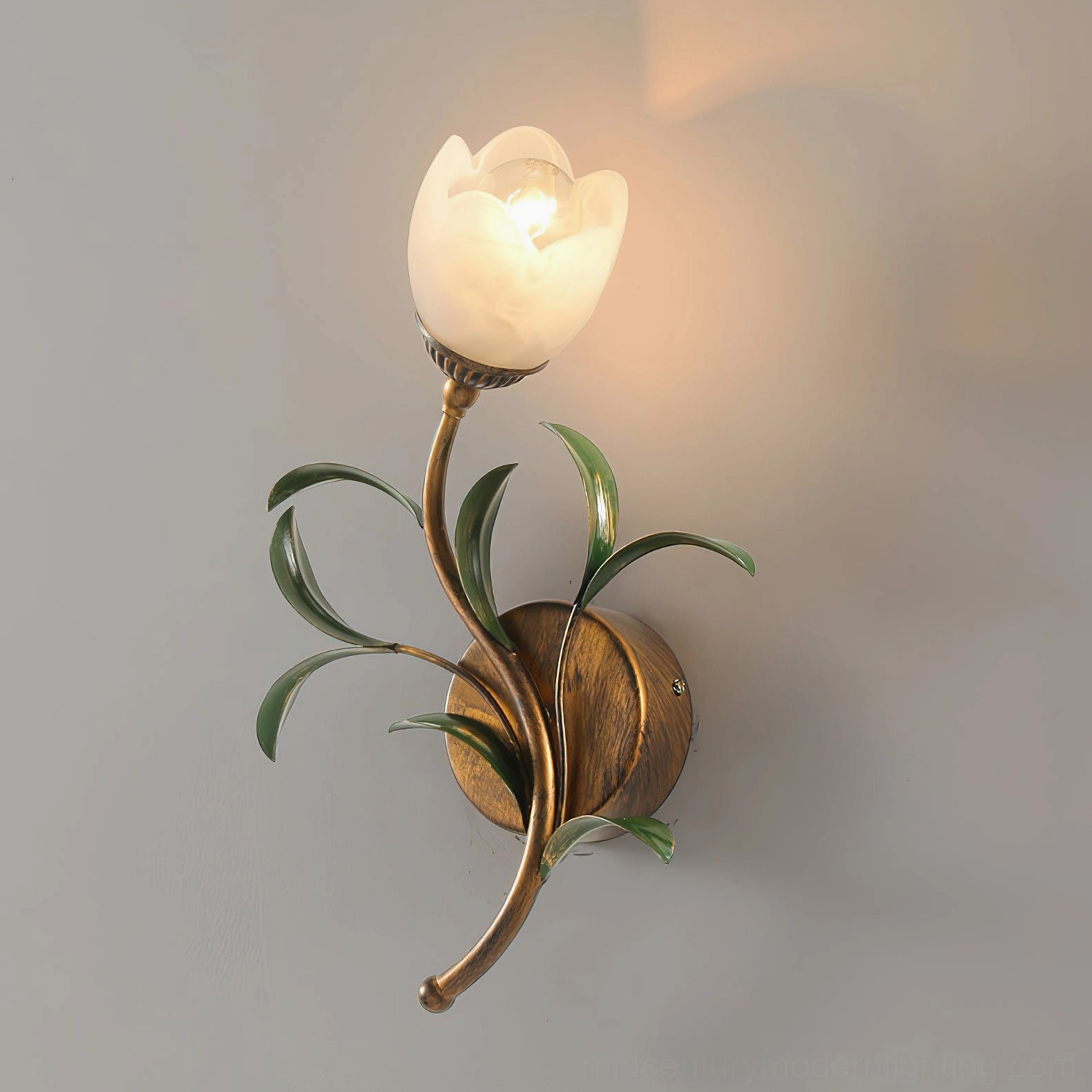 Jasmine wall sconce mid-century modern design with gold brass and green-tinted glass combination