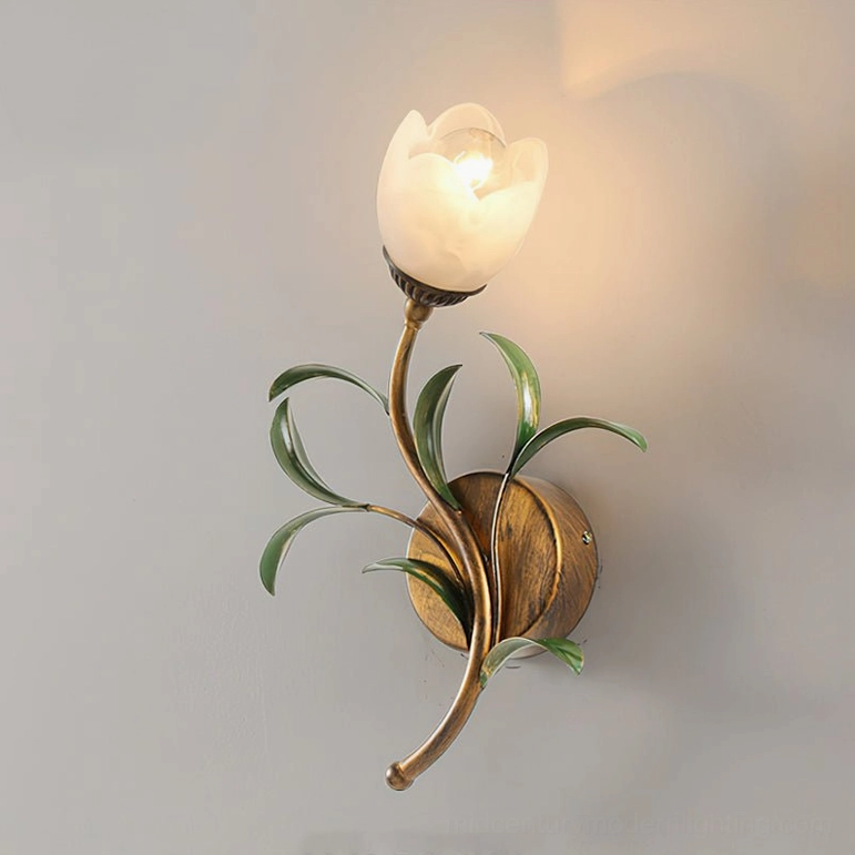 Jasmine single-light wall sconce close-up with frosted tulip glass shade and antique brass finish