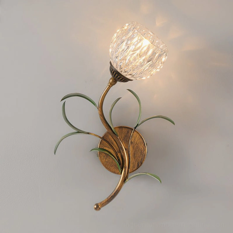Close-up side view of jasmine single-light wall sconce showing brass hardware and textured glass shade
