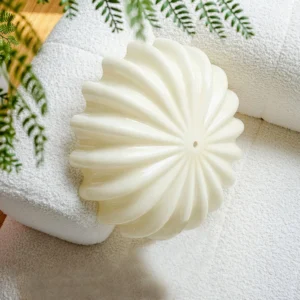 Jelly ceiling lamp detail, close-up top-down angle showing ribbed petal texture and warm cream glass