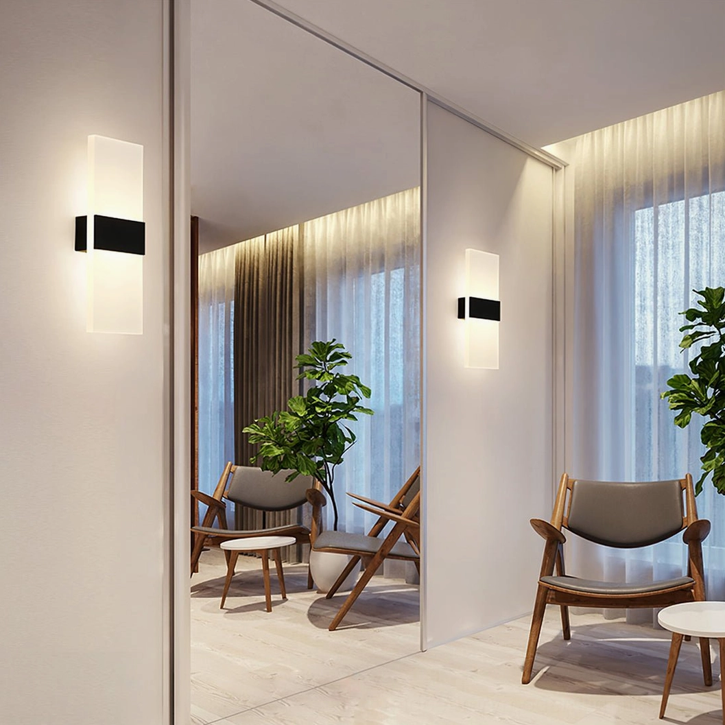 LED wall lamp with architectural silhouette and soft diffused illumination technology