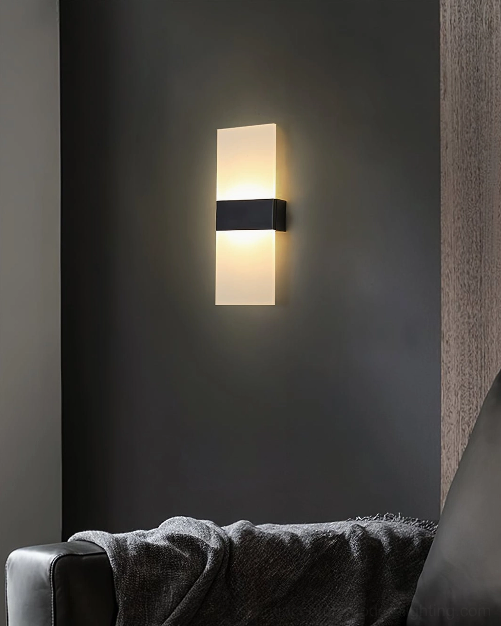 Minimalist LED wall sconce with clean geometric lines and integrated lighting technology