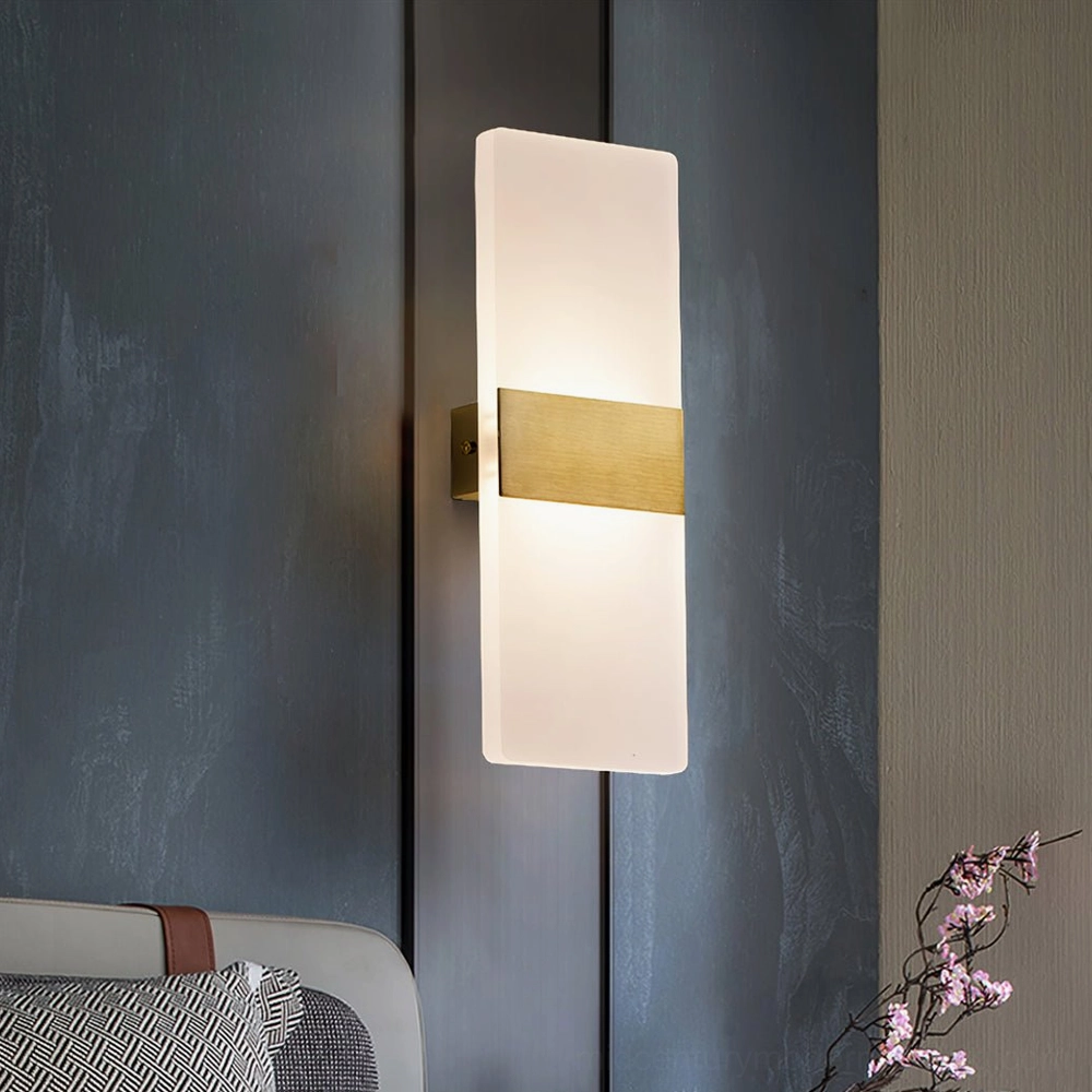 Vertical wall mounted sconce with frosted acrylic panels and metal accent band detail