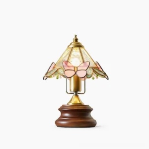 Jenny Butterfly Stained Glass Table Lamp with pink butterfly motifs and walnut wood base, front view on studio background