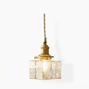 Jewel brass and clear glass pendant light - Model A compact square design with hammered glass shade and brass frame on white studio background
