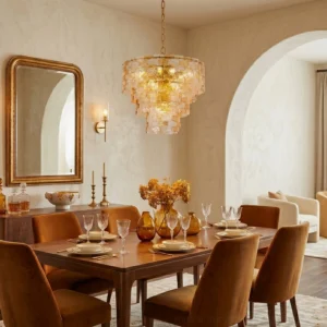 Jigsaw glass chandelier illuminated above formal dining table in elegant traditional dining room with warm lighting