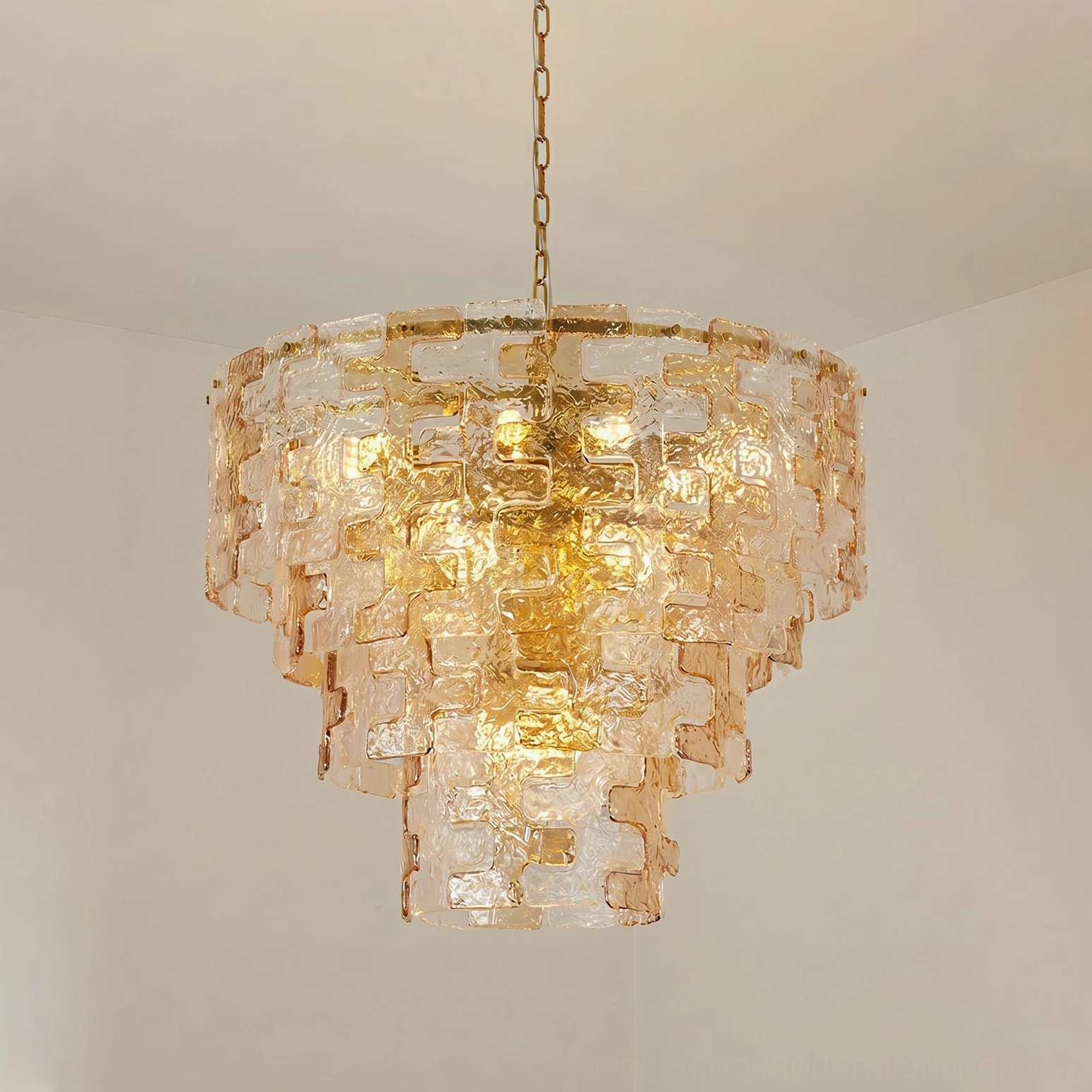 Jigsaw glass chandelier showing inverted ziggurat profile and metal frame engineering from side angle