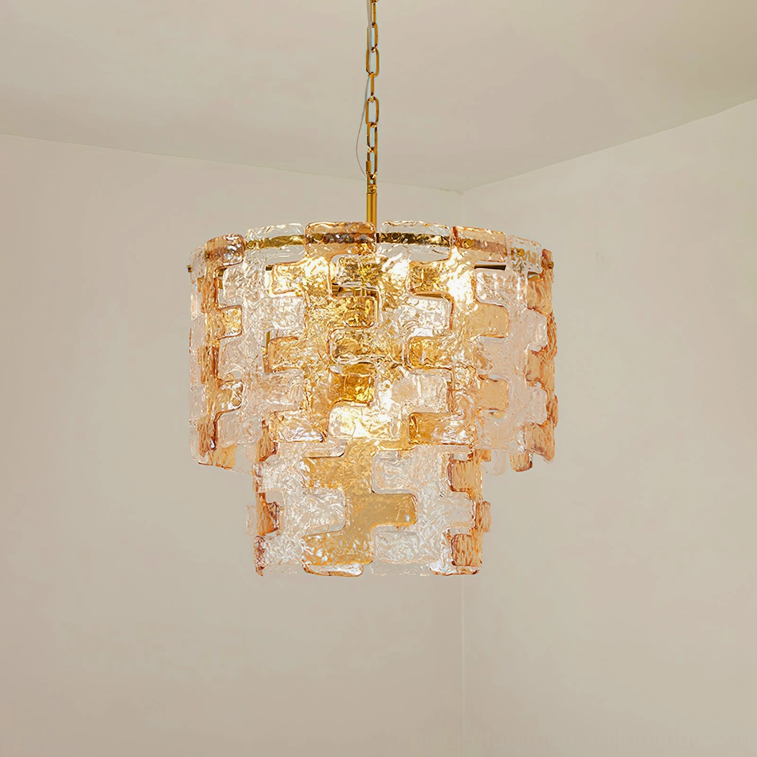Jigsaw tiered glass chandelier demonstrating light diffusion through water-ripple texture at different heights