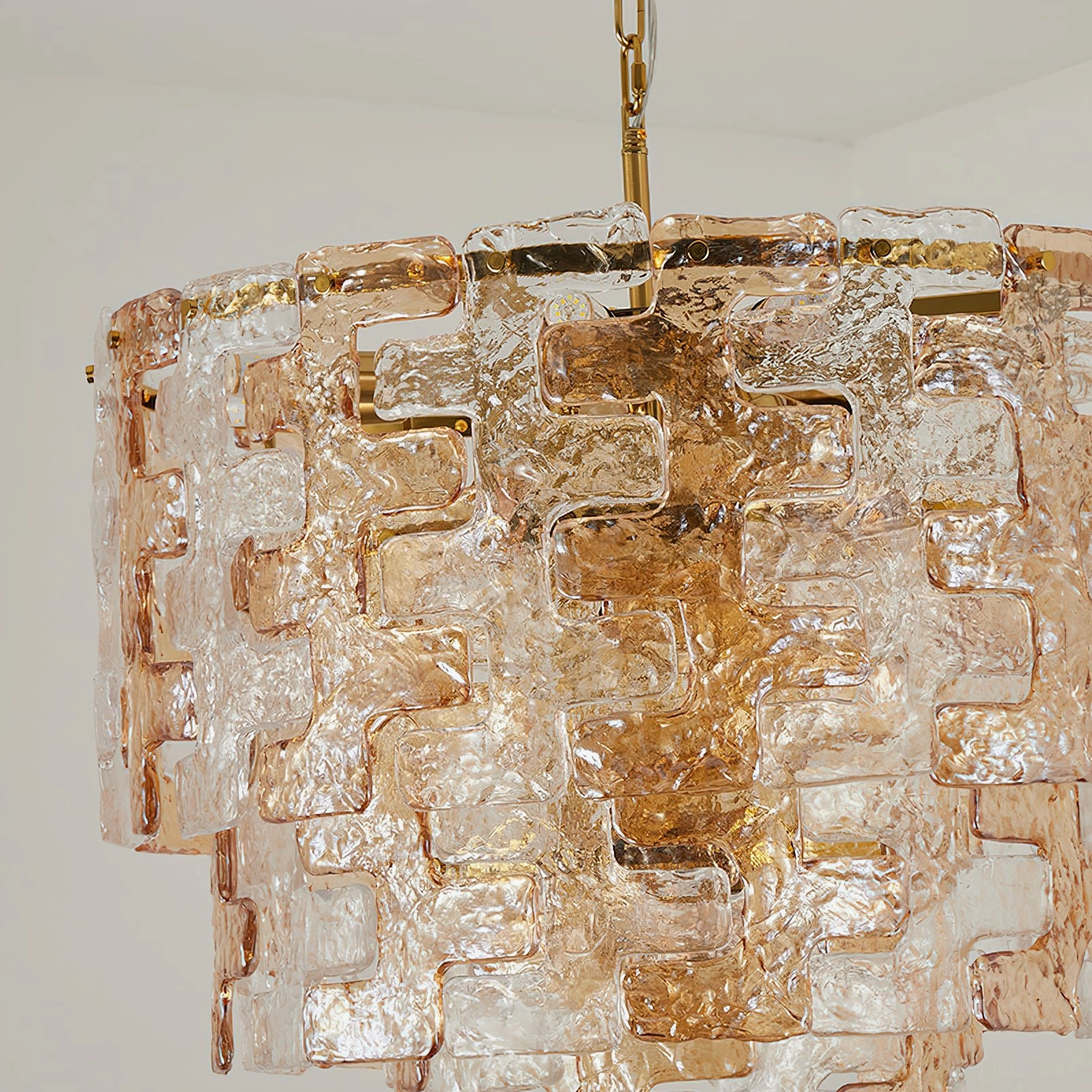 Medium Jigsaw glass chandelier with 16 sockets providing architectural presence in formal foyer entrance