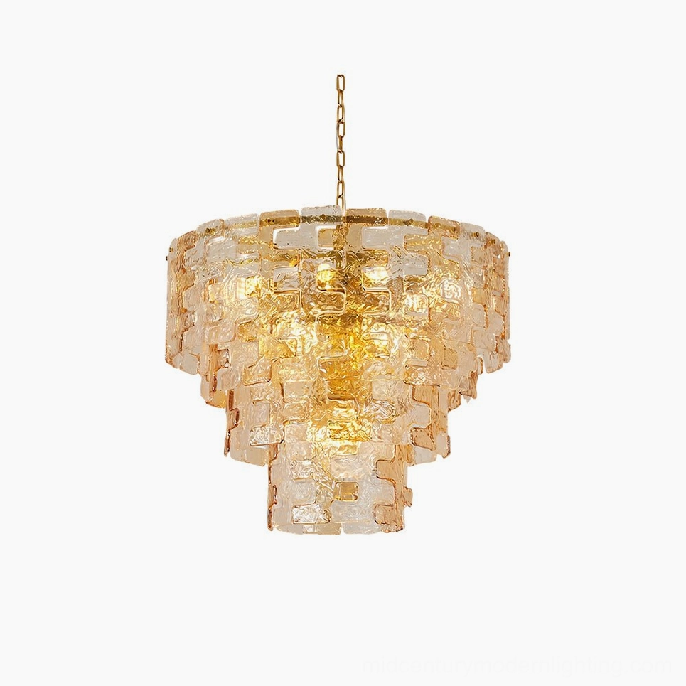 Jigsaw tiered amber glass chandelier with inverted pyramid silhouette on white studio backdrop