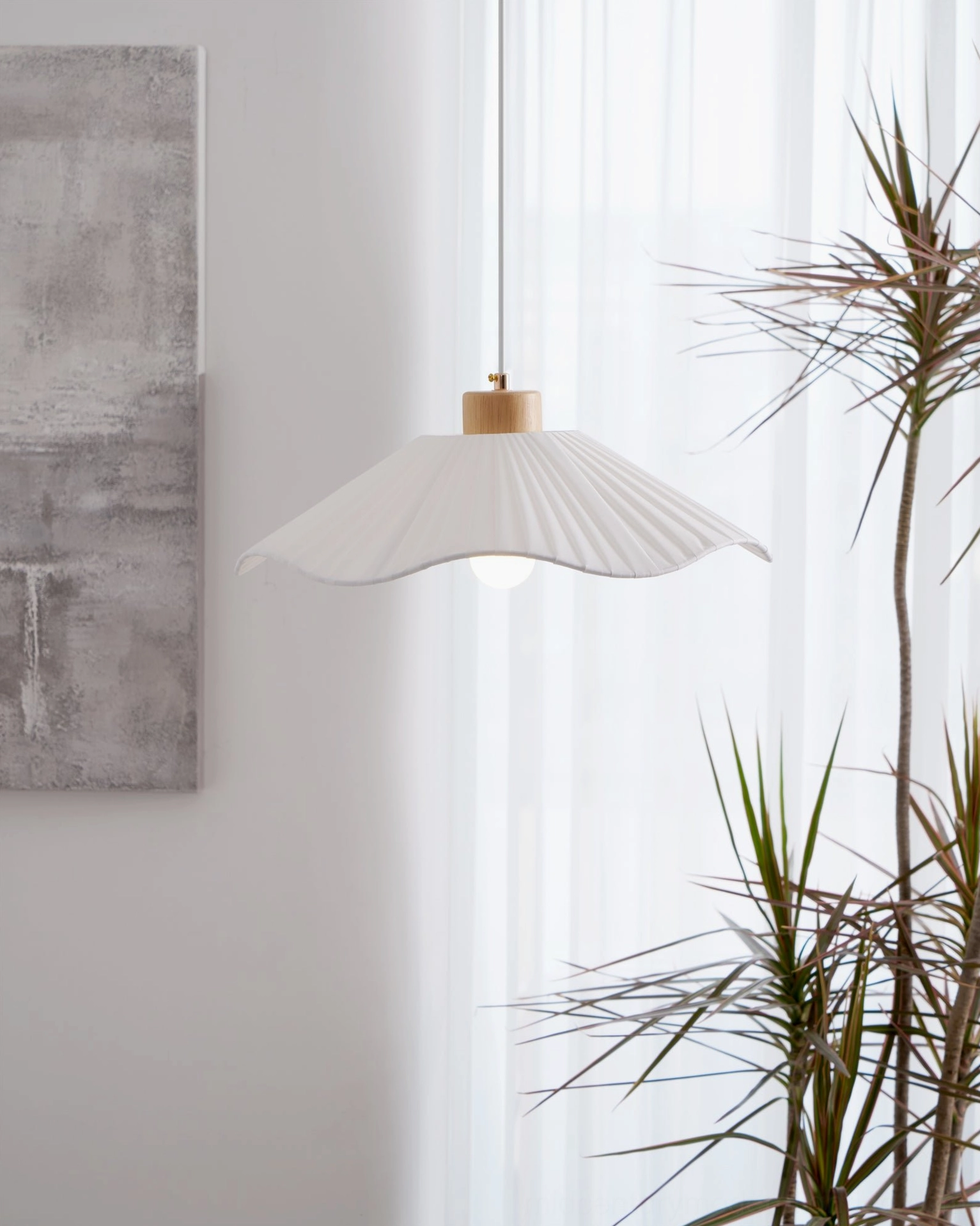 Jimi pendant light side angle, soft fabric shade with wooden top mount, hanging in modern space with sheer curtain backdrop