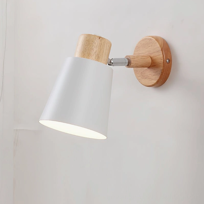 Joan wall lamp white and natural wood finish, front view displaying minimalist Nordic aesthetic on white wall