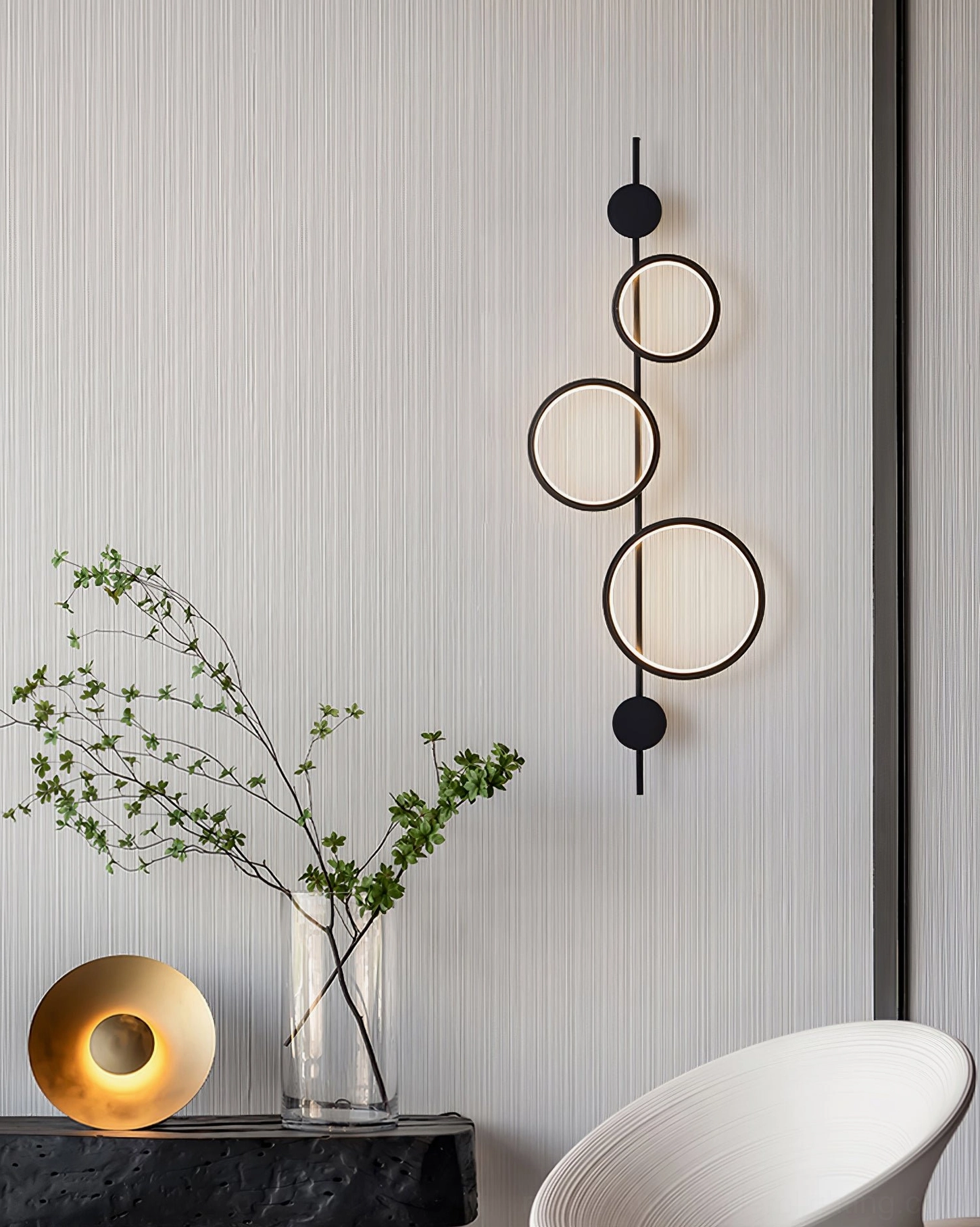 Jocco black vertical wall lamp mounted in contemporary home corner minimalist decor setting