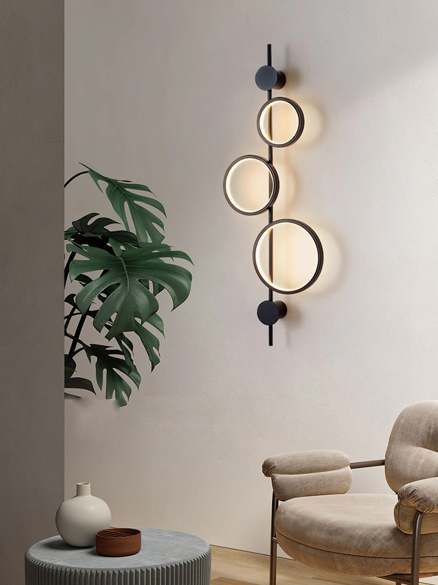 Jocco ring lamp side view showing warm LED ambient lighting in cozy minimalist lounge space
