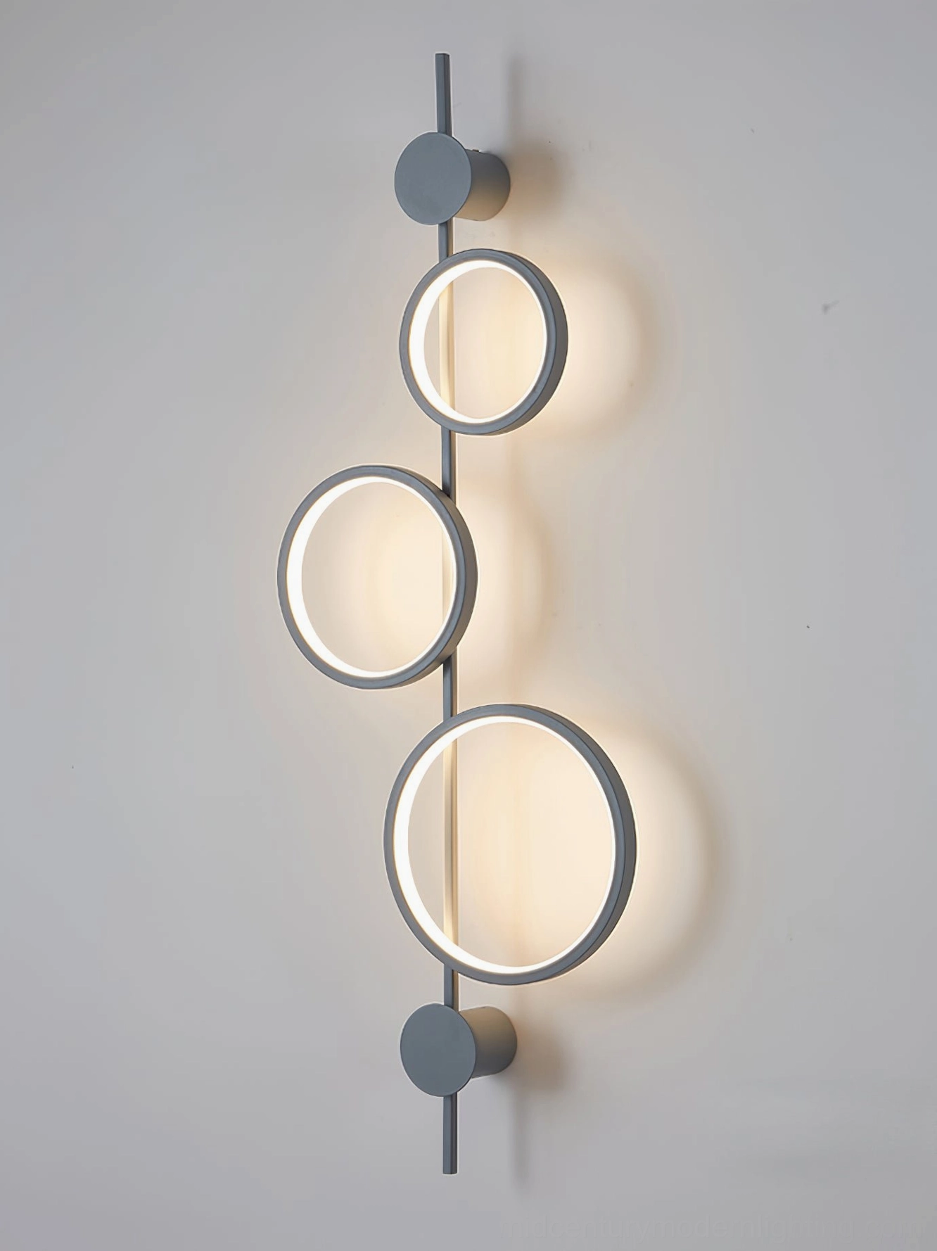 Jocco vertical wall lamp warm light variant installed in modern residential space