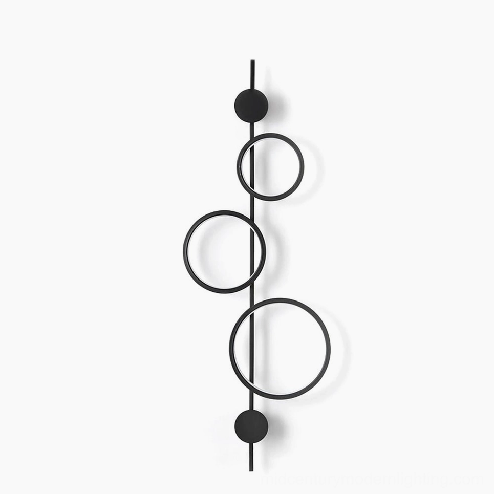 Jocco vertical ring wall lamp studio shot - modern minimalist matte black metal design with hollow circular form