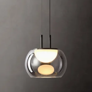 Close-up of Johan pendant showing dual LED light orbs glowing through smoked glass