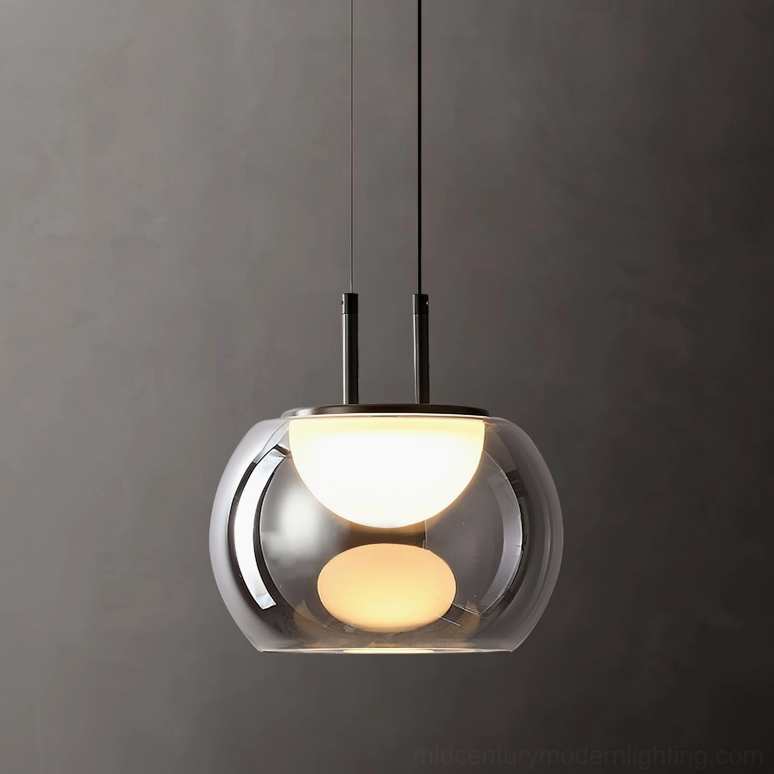 Close-up of Johan pendant showing dual LED light orbs glowing through smoked glass