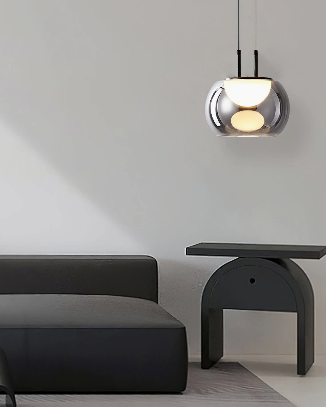 Single compact Johan pendant hanging in minimalist modern living room