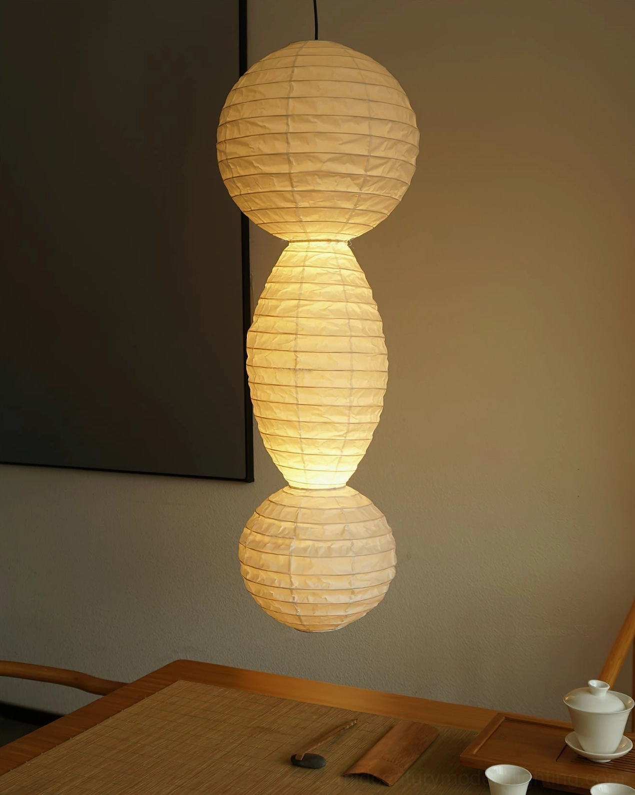 Juni stacked paper pendant lamp direct front wooden tea table warm beige texture