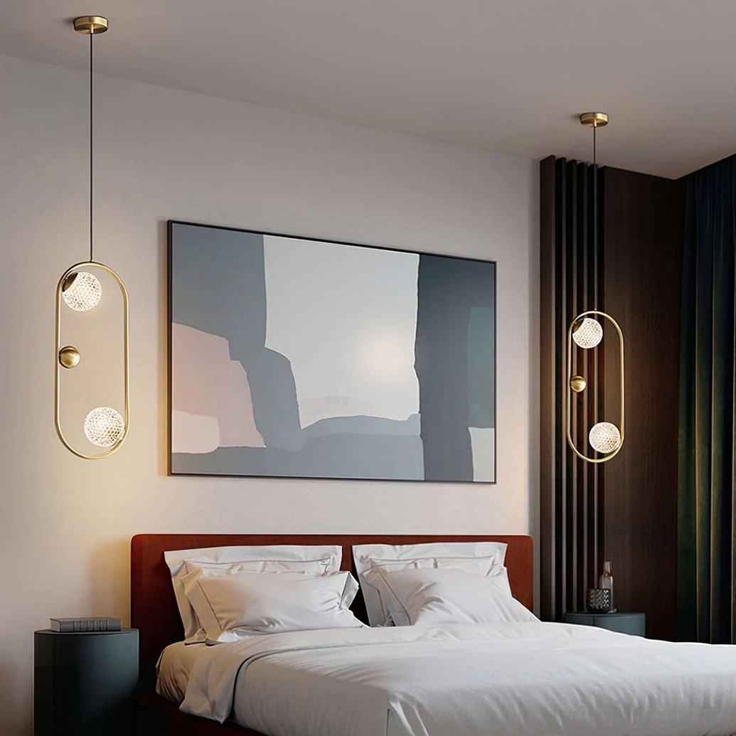 Pair of Jupiter brass pendant lamps in master bedroom with abstract wall art, wide view of high-end modern home interior installation