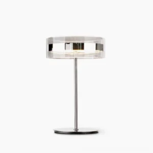 Kaede minimalist table lamp with polished chrome stem and clear acrylic shade, front studio view