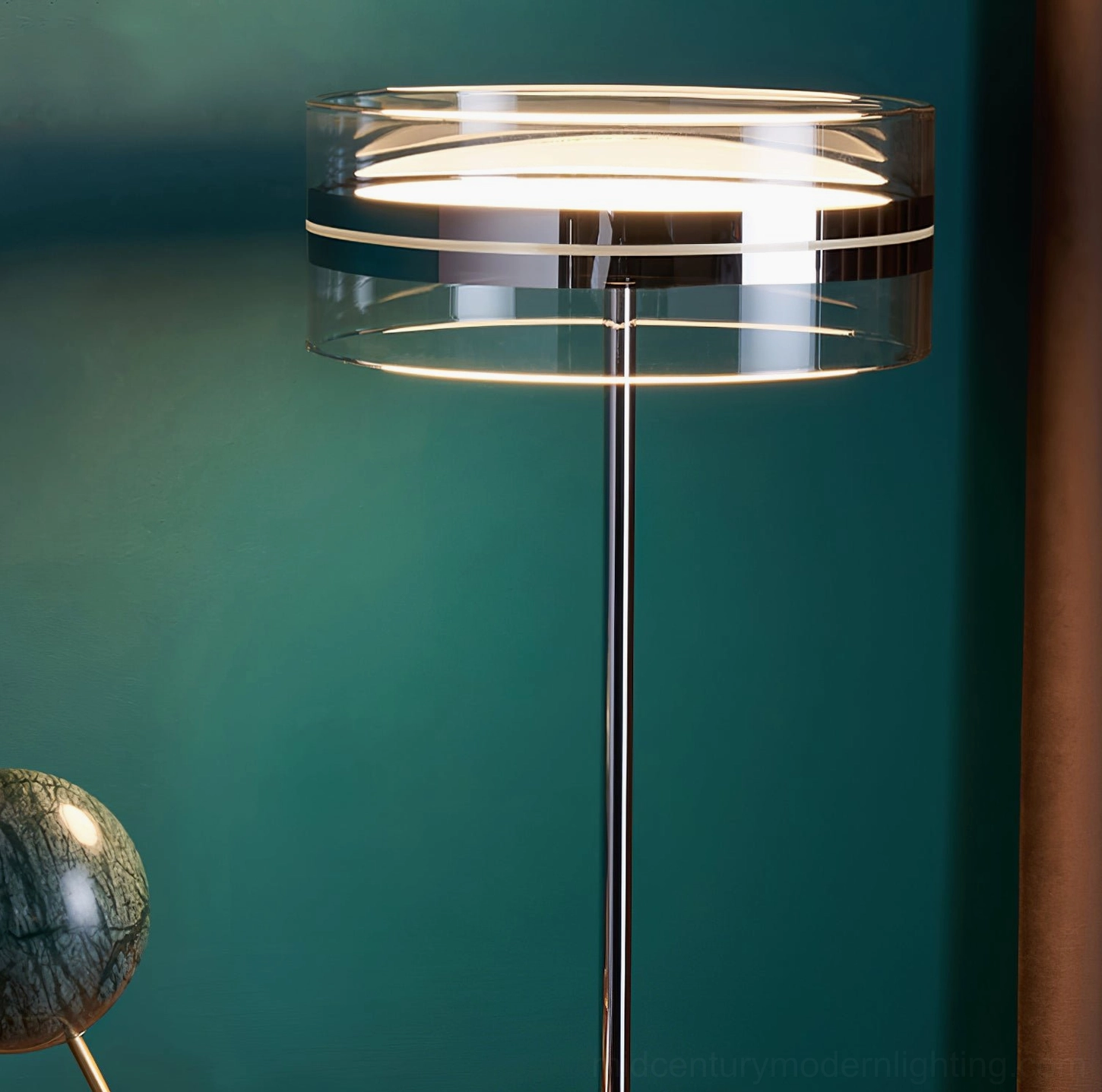 Kaede floor lamp with multi-layer glass shade and ring-shaped glowing LED lights against dark teal accent wall