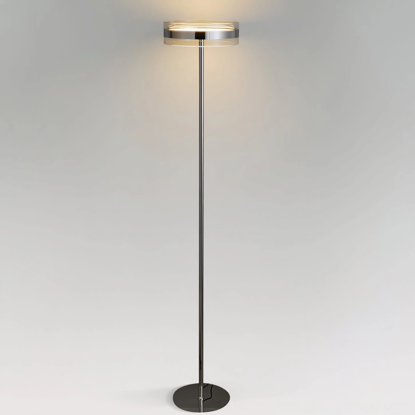 Kaede minimalist floor lamp side profile view showing slim cylindrical pole with round base on light gray backdrop