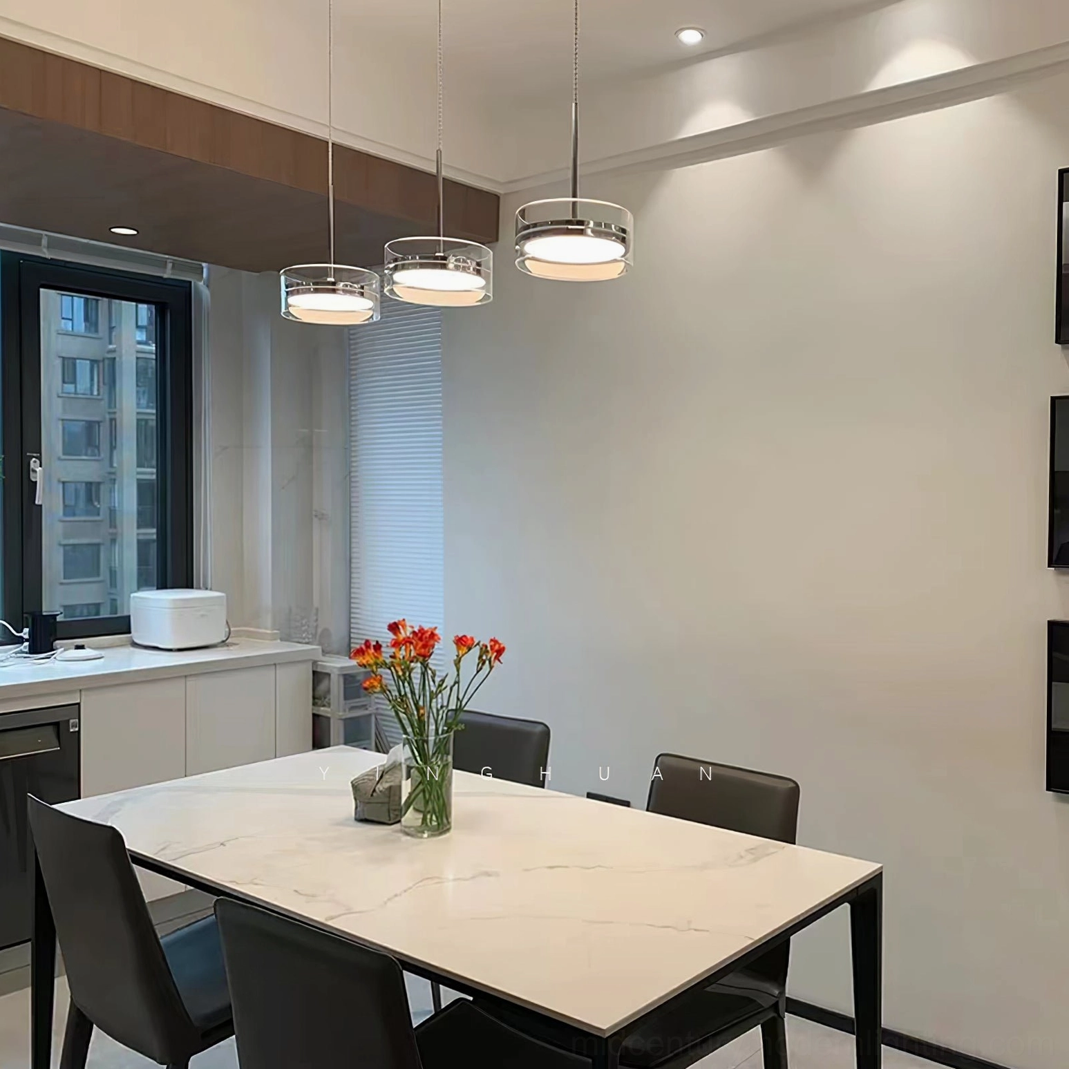 Multiple Kaede ring pendants in minimalist white dining room with marble table and clean modern design
