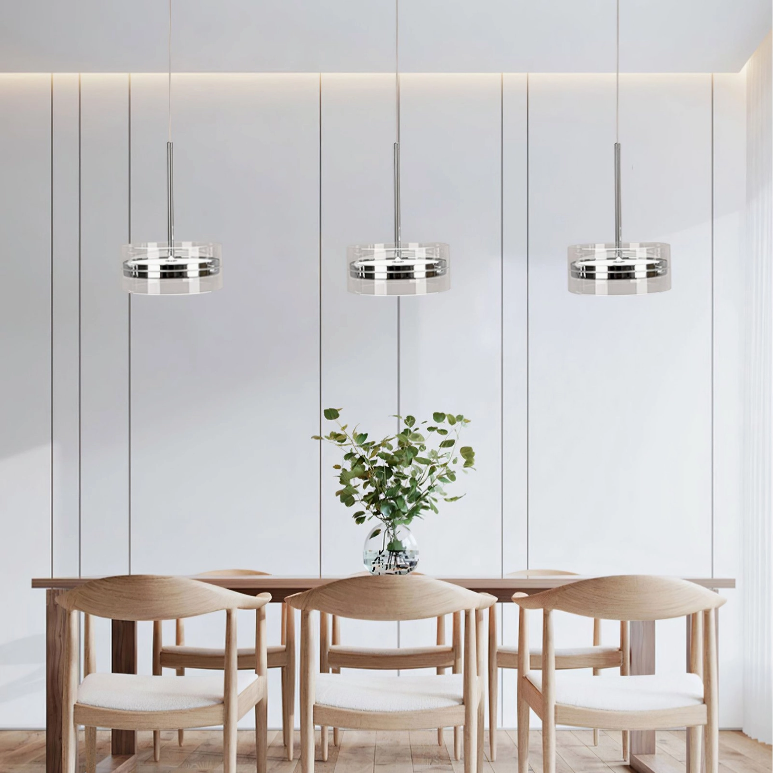 Triple arrangement of Kaede pendant lights creating cohesive modern lighting design feature