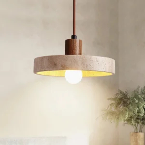 Single Kairi pendant lamp installed with warm exposed bulb creating ambient lighting in room interior