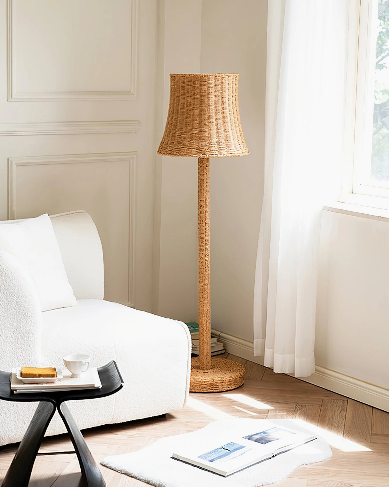 Kakasi rattan floor lamp in hallway side view, showing handcrafted cone silhouette with person walking