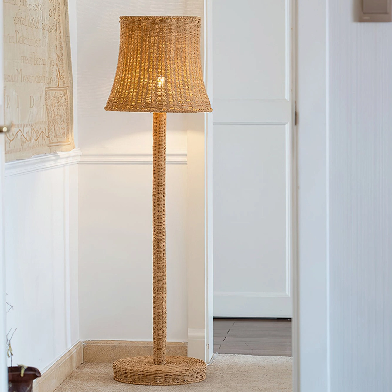 Kakasi floor lamp in modern hallway with white wall paneling, demonstrating contemporary home decor integration