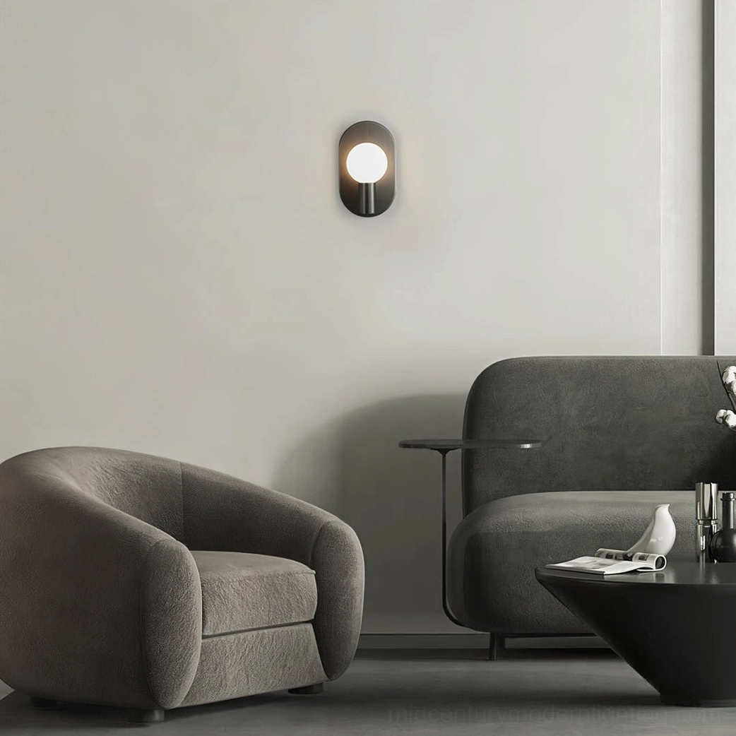Kalux minimalist wall lamp in modern living room with lounge chairs and understated warm light