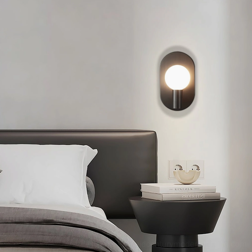 Kalux wall sconce providing subtle warm accent lighting in contemporary bedroom interior design