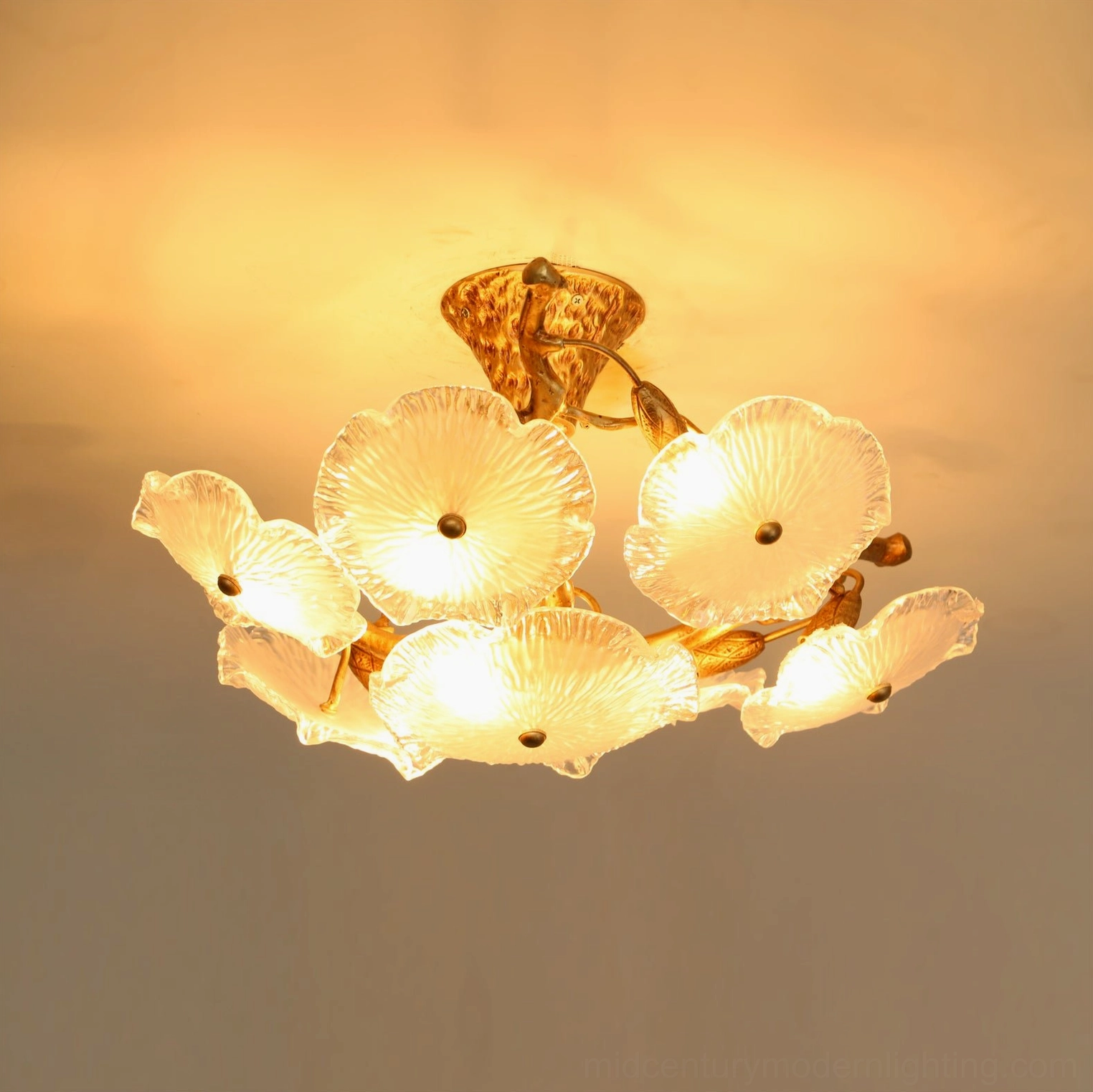 Kamal lotus ceiling fixture with hammered brass finish and hand-blown glass diffuser petals