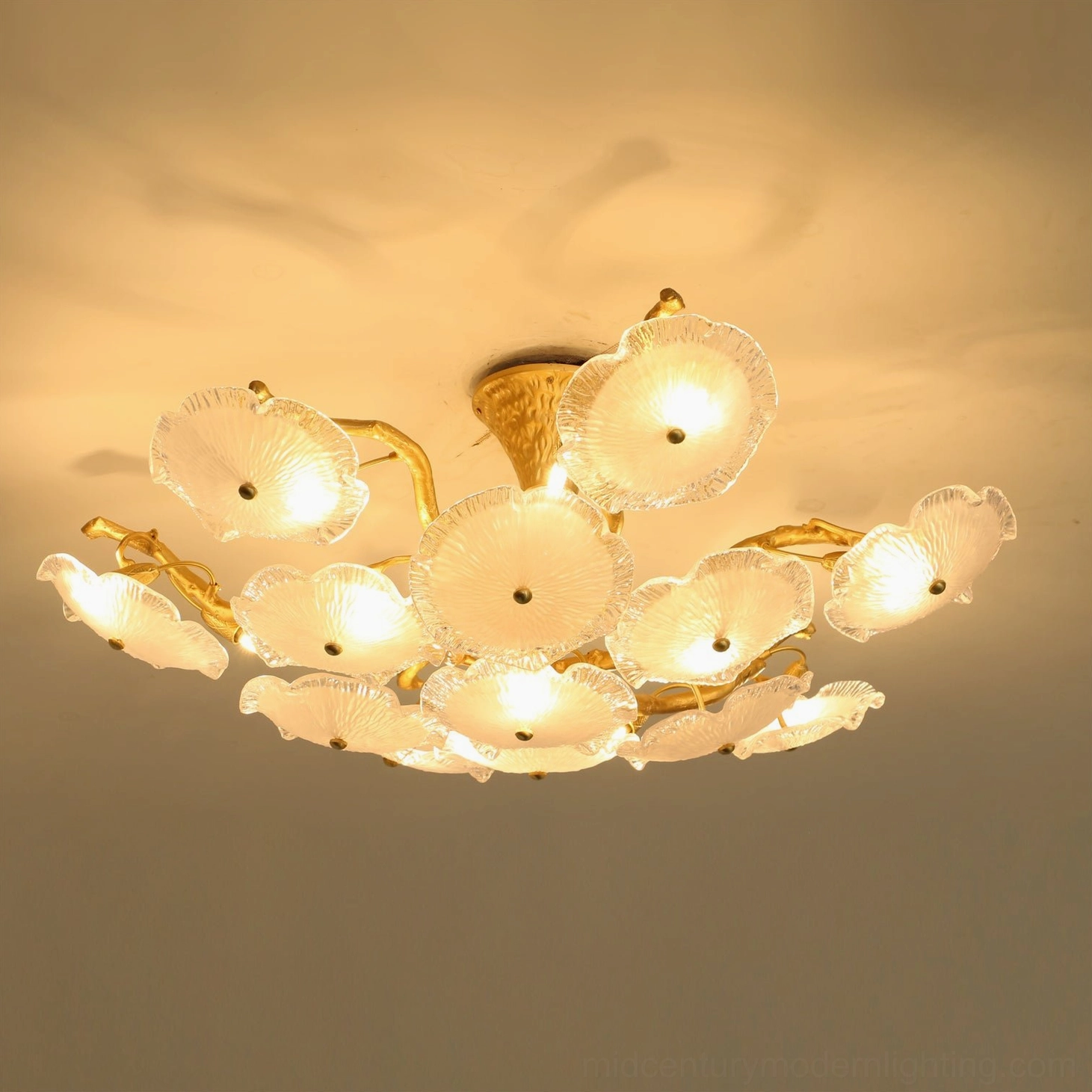 Illuminated Kamal ceiling light fixture with warm ambient glow, residential indoor installation