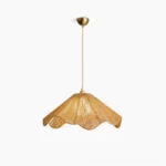Karai handwoven hemp rope pendant light with scalloped wavy shade and brass-toned metal hardware, overhead front studio view