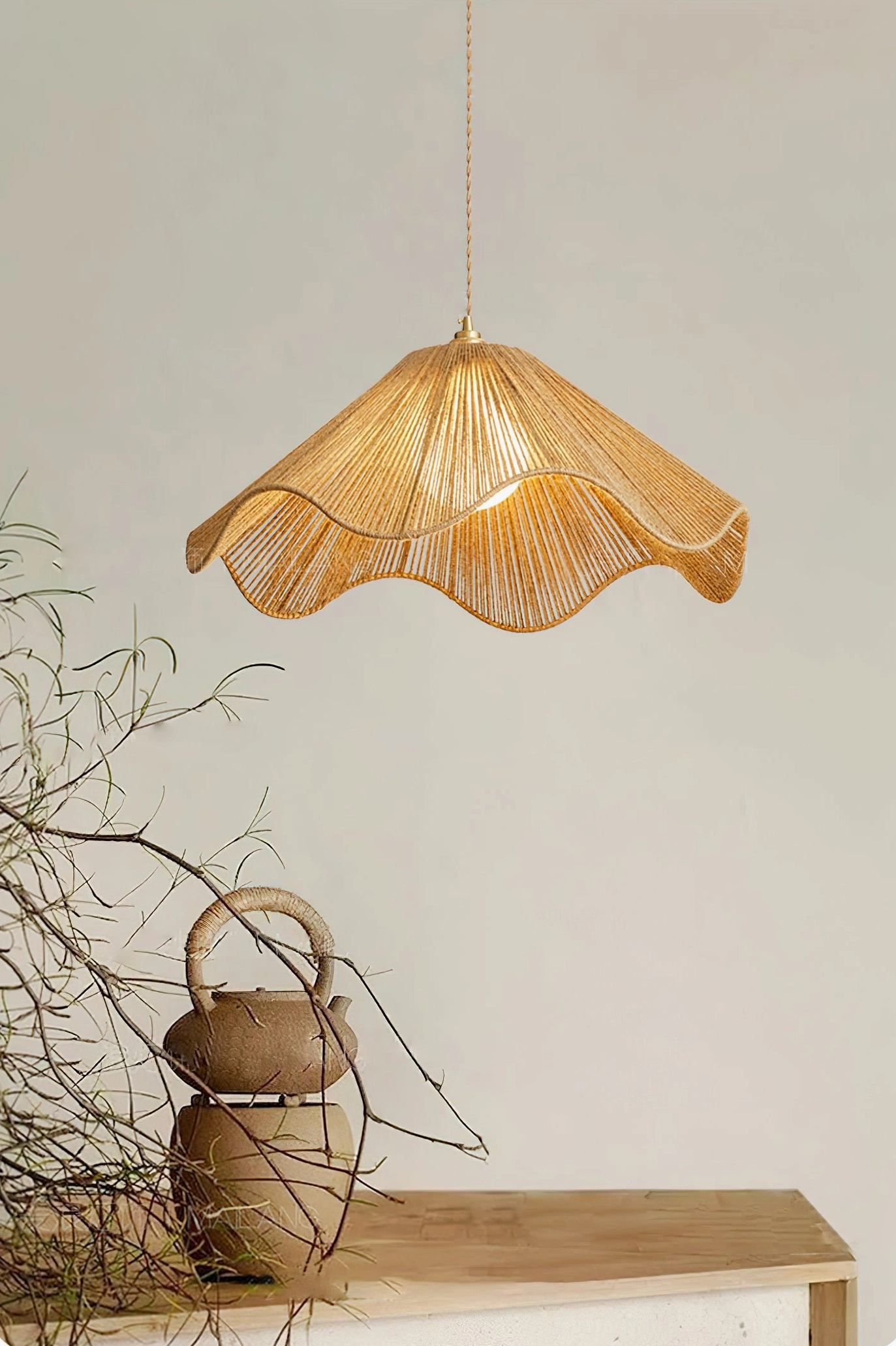 Close-up detail of Karai pendant shade showing slim woven rattan strips, light brown natural color, and delicate scalloped rim