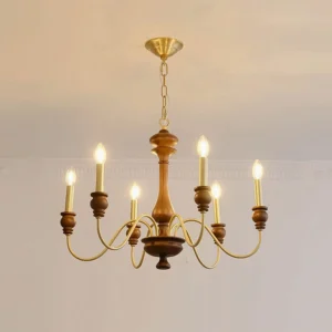 6-head Karalea chandelier with brass arms and dark wood center post, installed in traditional dining room setting
