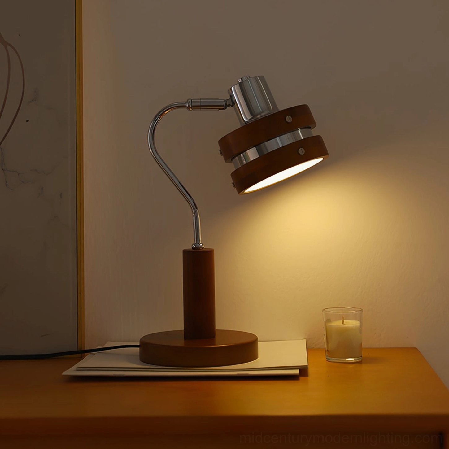Elegant table lamp with walnut base and adjustable chrome head in modern home office setting