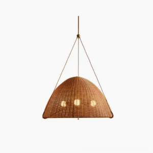 Kash natural rattan dome pendant light with gold metal frame, studio front view