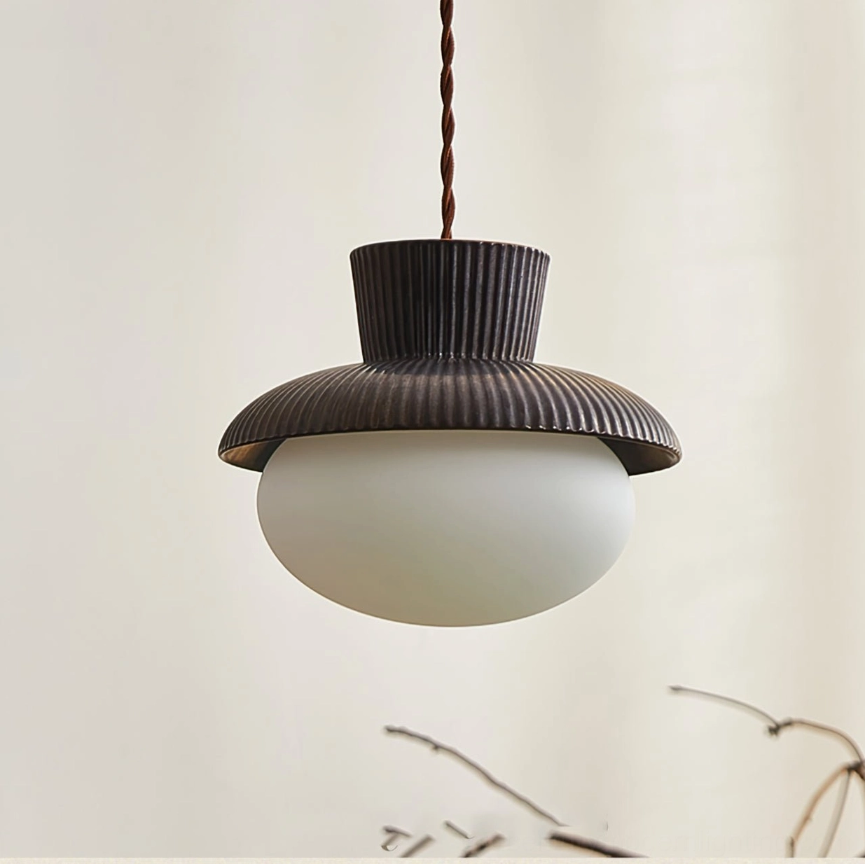 Unlit Kaskad ribbed ceramic and frosted glass pendant fixture, front direct view highlighting scandinavian minimalist design aesthetic