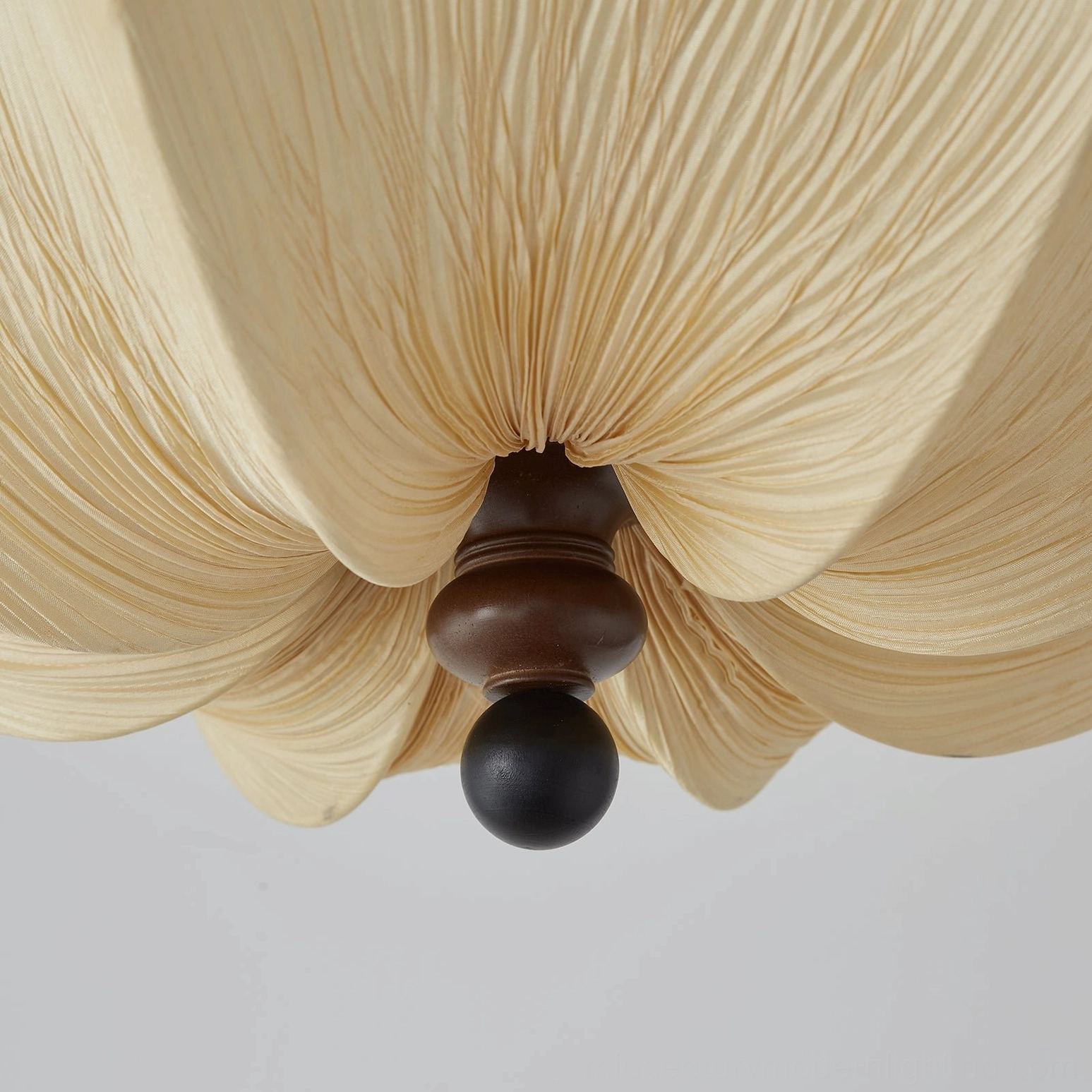 Kateo ceiling pendant light showing lotus-like silhouette, hand-folded fabric aesthetic and warm illumination