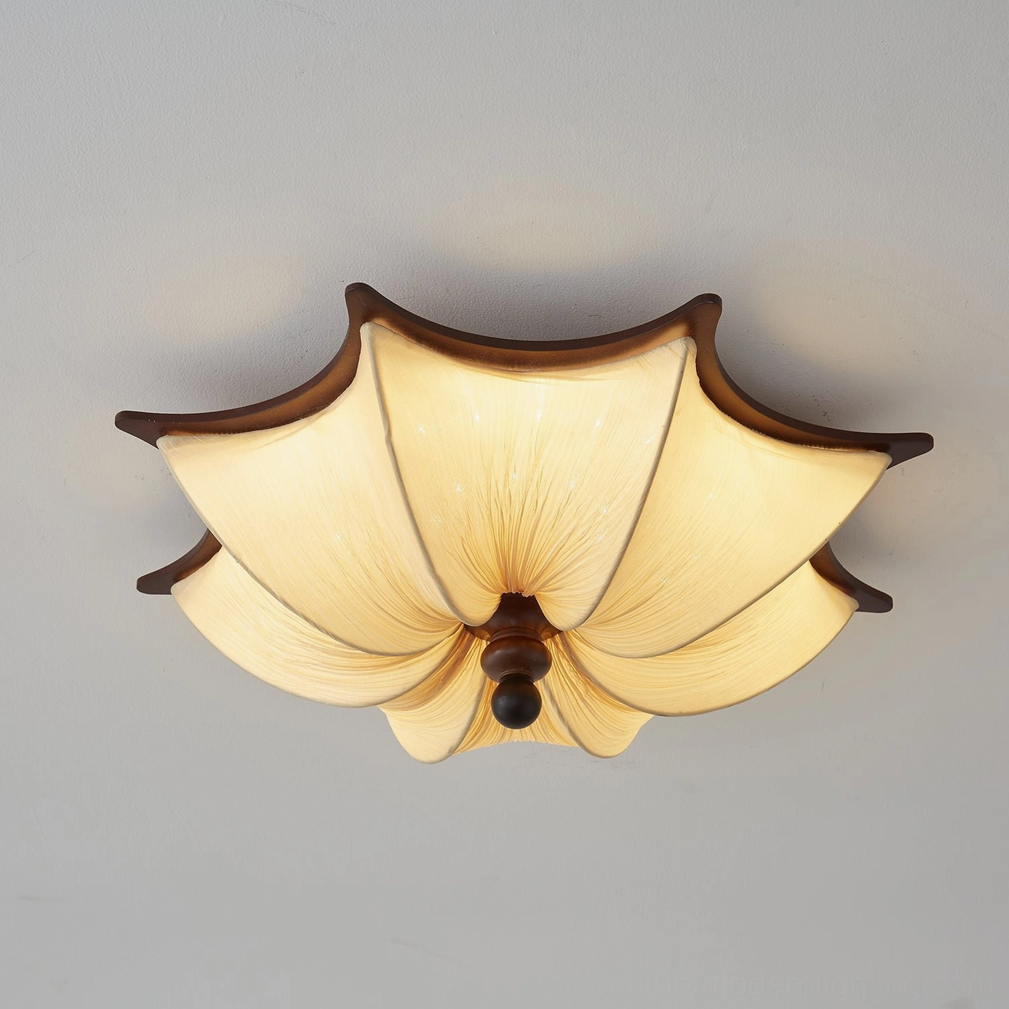 Kateo modern ceiling light with organic pleated textile design, artistic fabric folds and sculptural form