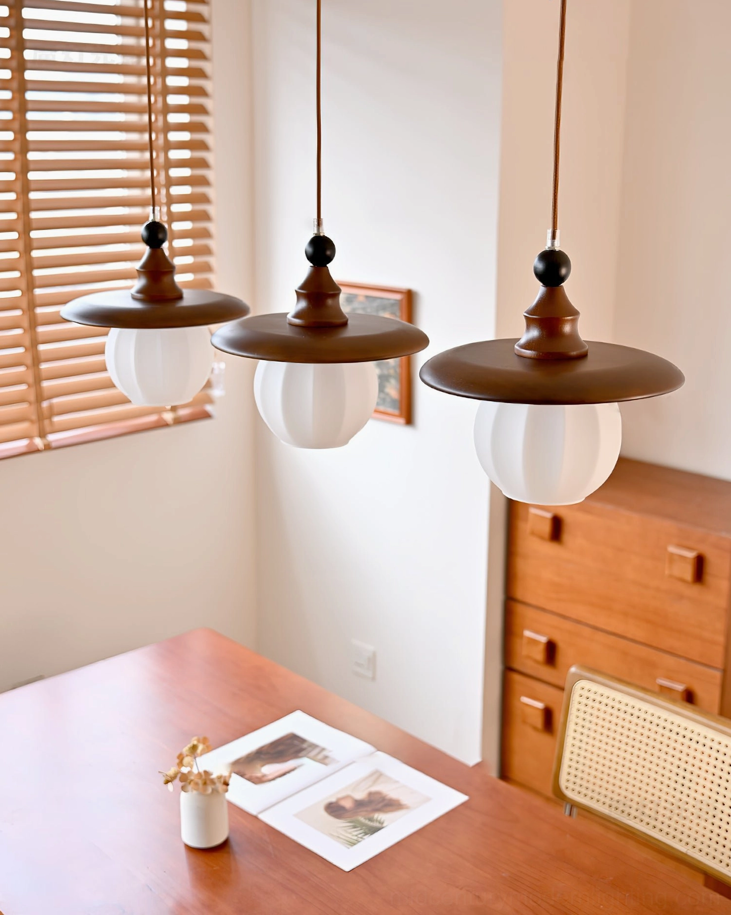 3-light Kato pendant set in minimalist dining area with mid-century modern interior design