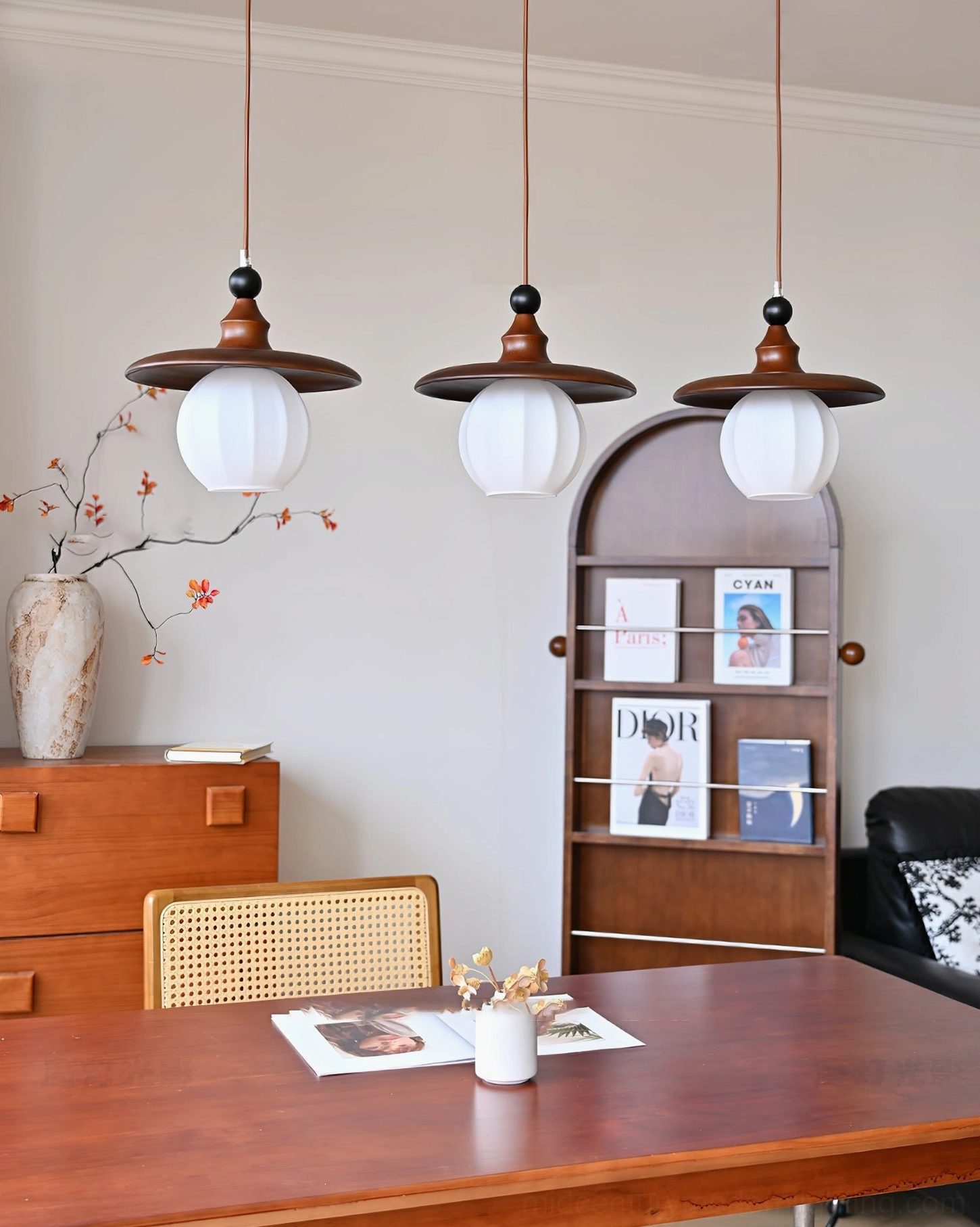3-light Kato pendant cluster in fully furnished vintage dining space with neutral warm tones