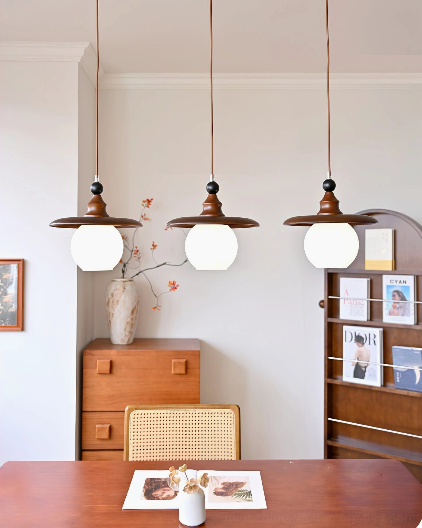 3-light Kato pendant lighting in clean minimalist vintage dining area with warm styling
