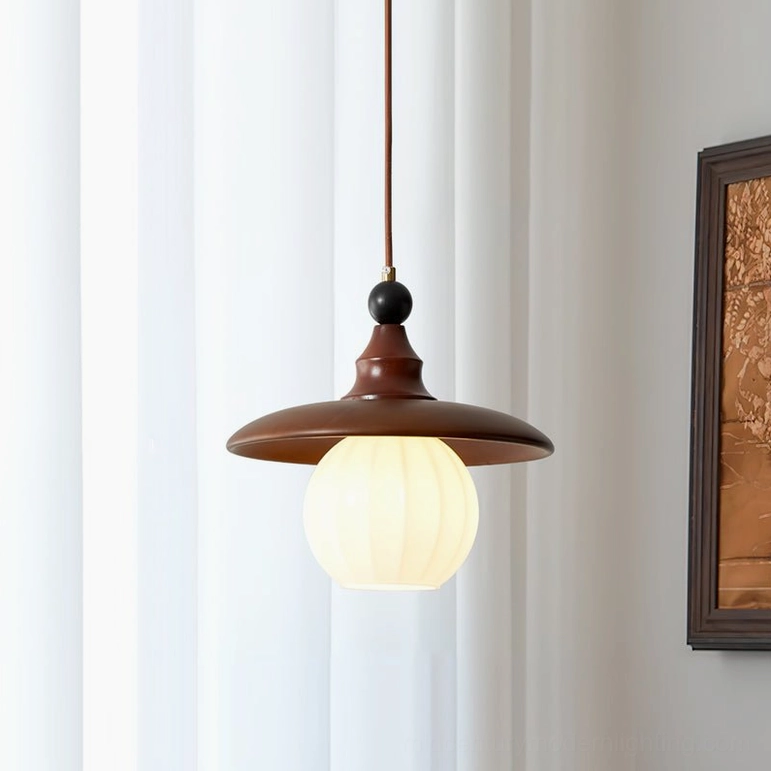 Kato medium pendant light with walnut shade, tabletop styling view